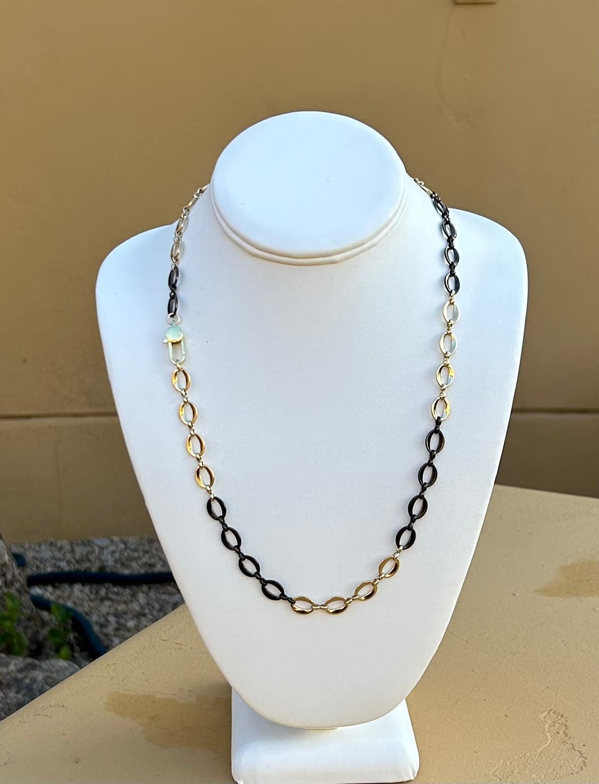 Necklace - Gold and black oval chain with a diaper pin clasp