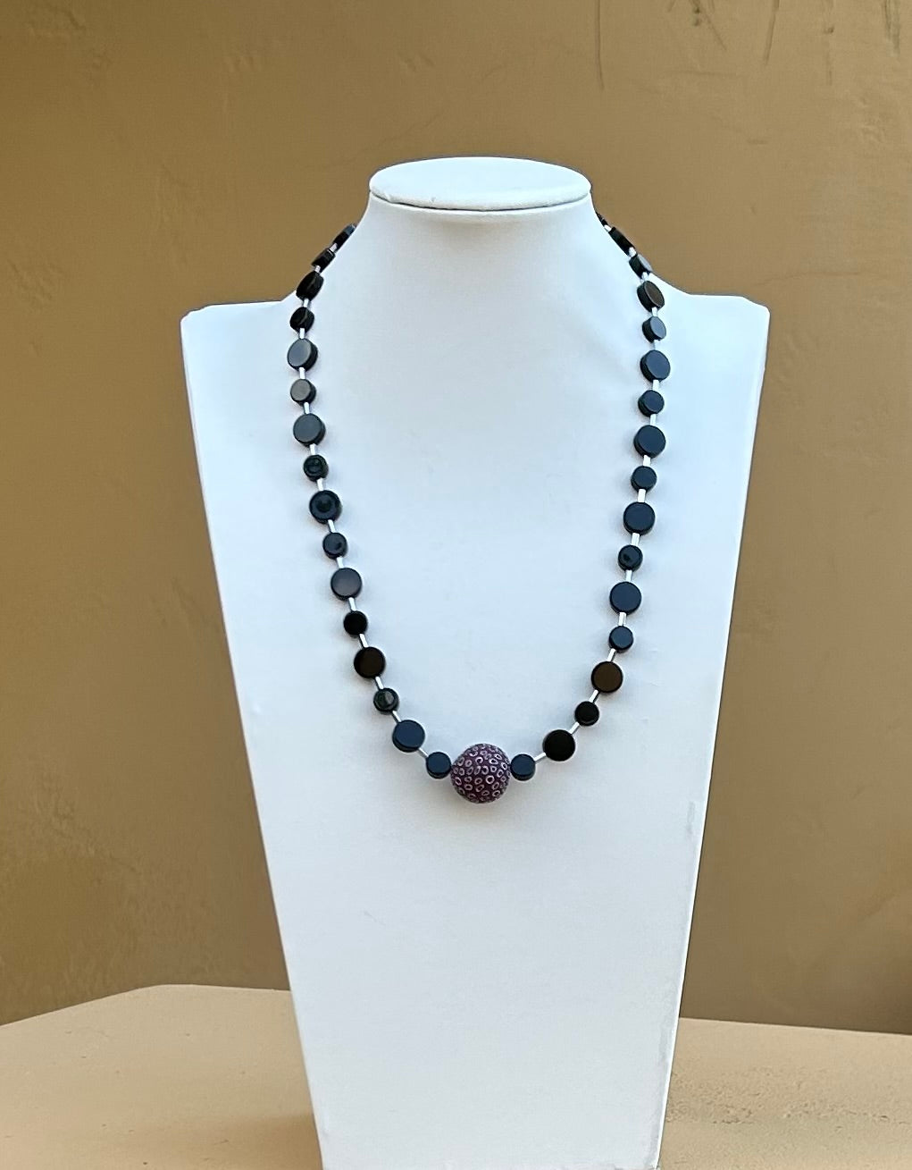 Necklace - Black onyx with silver hematite spacers and a dark red white and grey clay bead