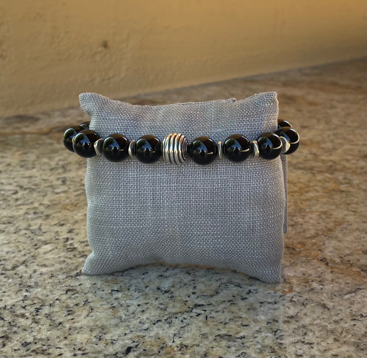 Bracelet - 10mm black onyx stretch bracelet with silver spacers