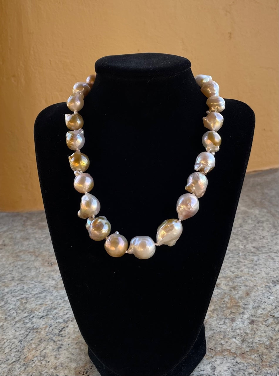 Necklace - Graduated large natural baroque pearls with a pave diamond clasp