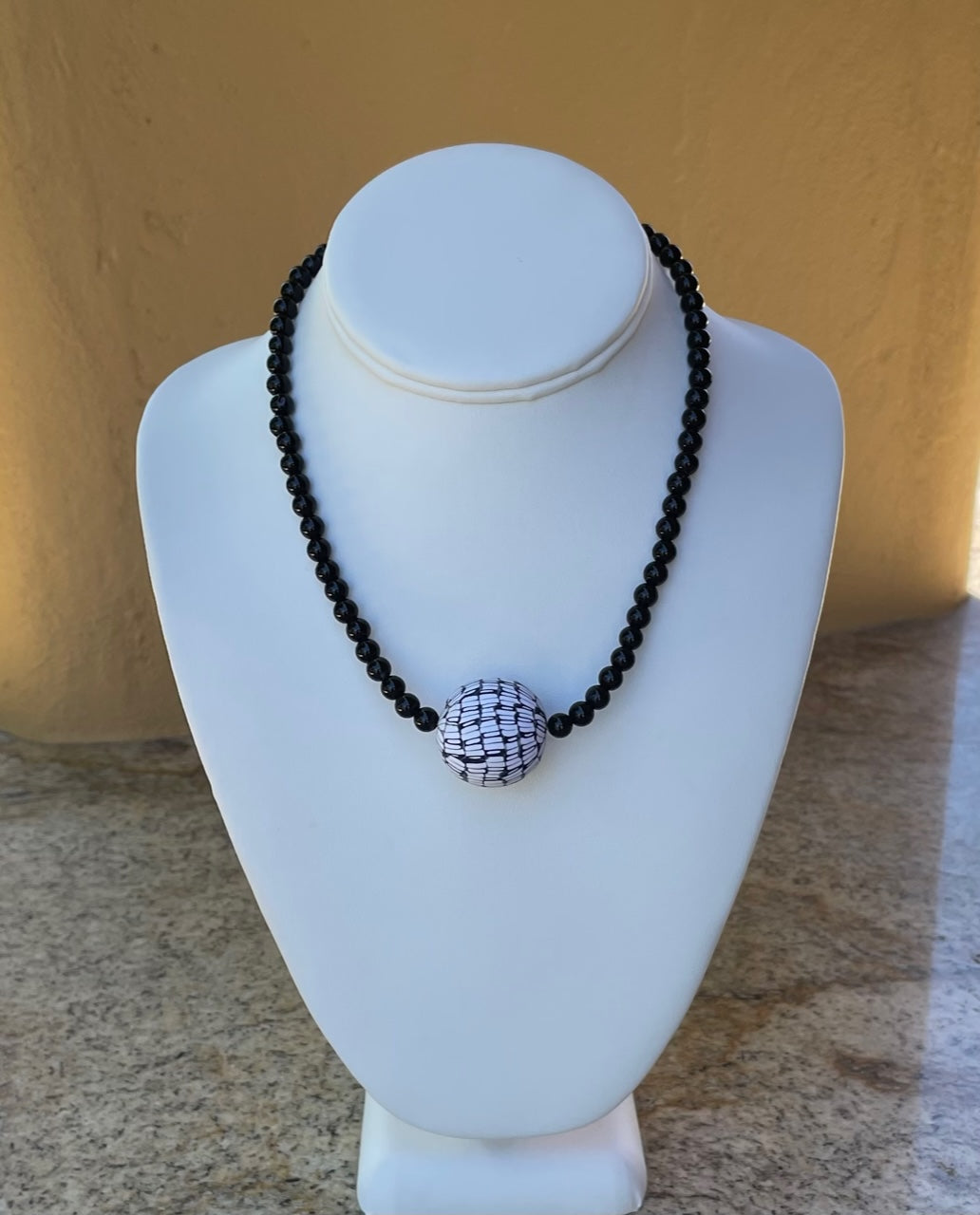 Necklace - Black onyx and a large black and white handmade clay bead